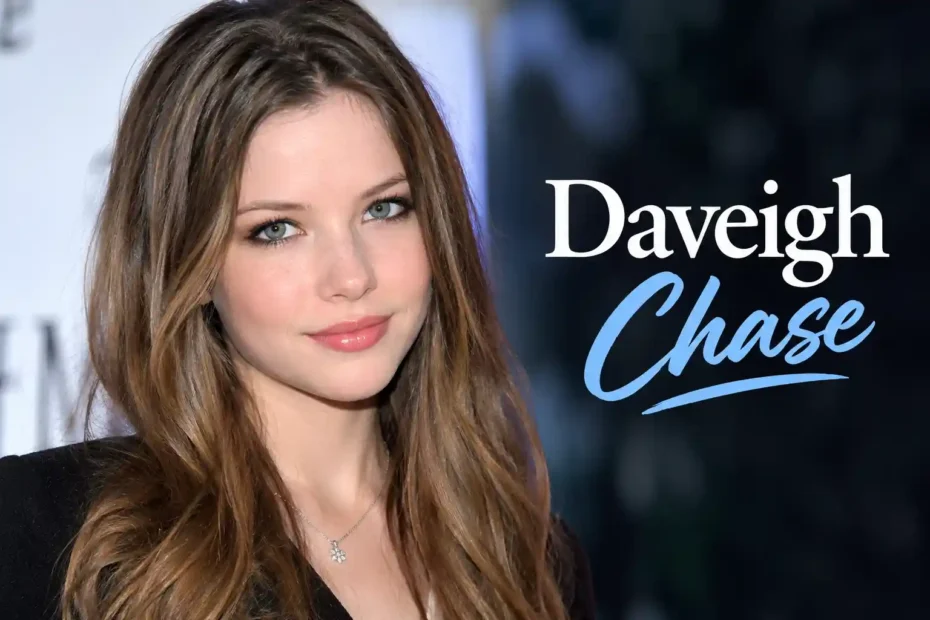 Daveigh Chase close-up portrait with long brown hair blue eyes and necklace looking at camera
